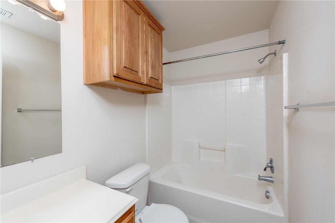 1001 Krenek Tap Road, Unit 1102 College Station, TX 77840 - Photo 14 of 26 a bathroom with a shower a toilet and a sink