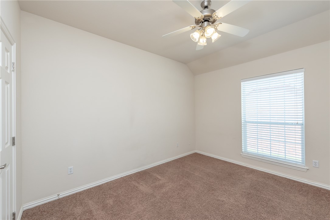 1001 Krenek Tap Road, Unit 1102 College Station, TX 77840 - Photo 16 of 26 an empty room with a window and a fan