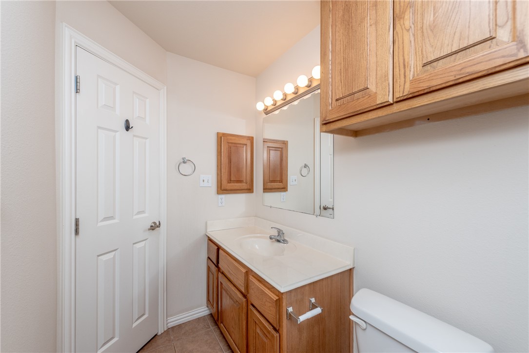 1001 Krenek Tap Road, Unit 1102 College Station, TX 77840 - Photo 17 of 26 a bathroom with a sink a toilet and shower