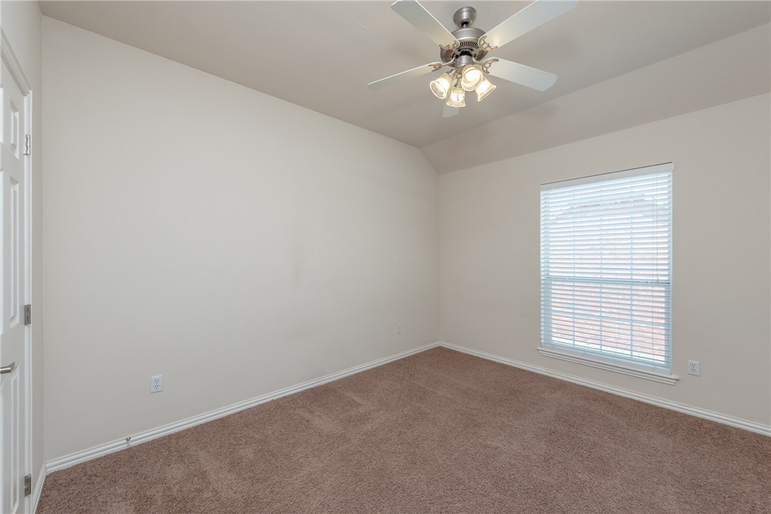 1001 Krenek Tap Road, Unit 1102 College Station, TX 77840 - Photo 20 of 26 an empty room with a window and a ceiling fan