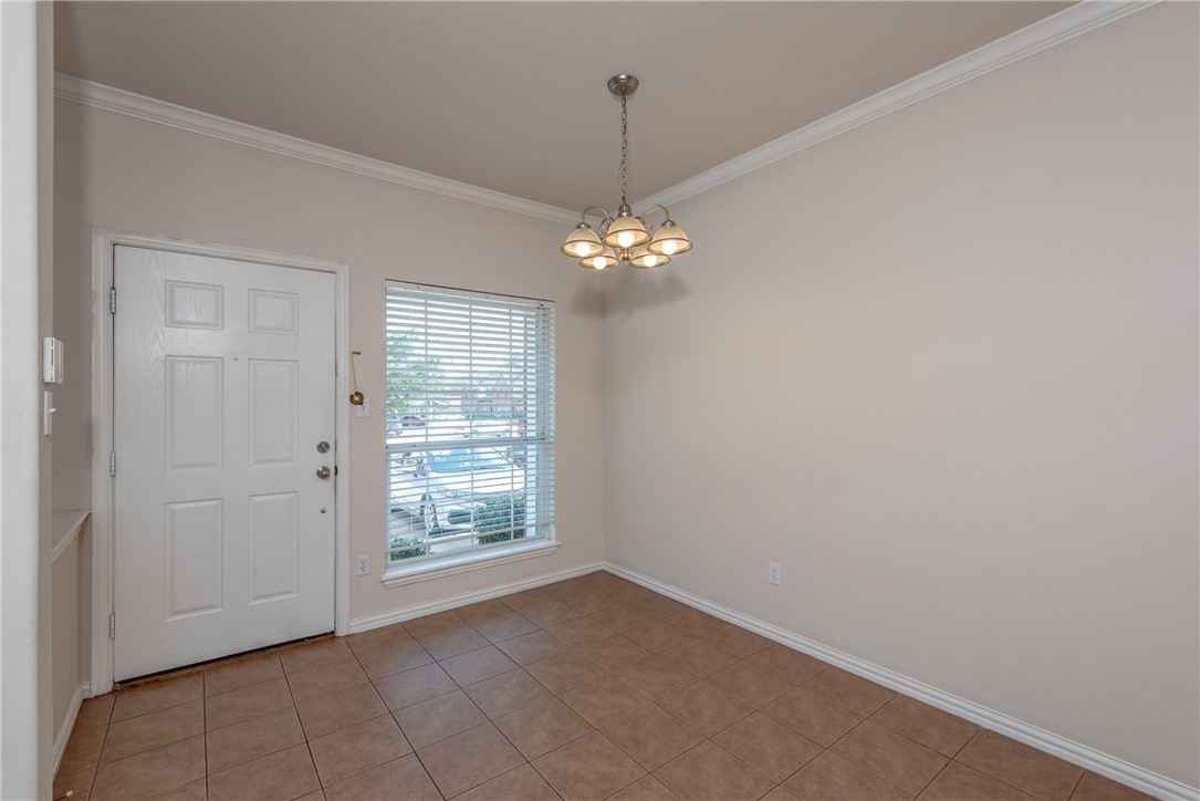 1001 Krenek Tap Road, Unit 1102 College Station, TX 77840 - Photo 2 of 26 a view of an empty room with window chandelier fan