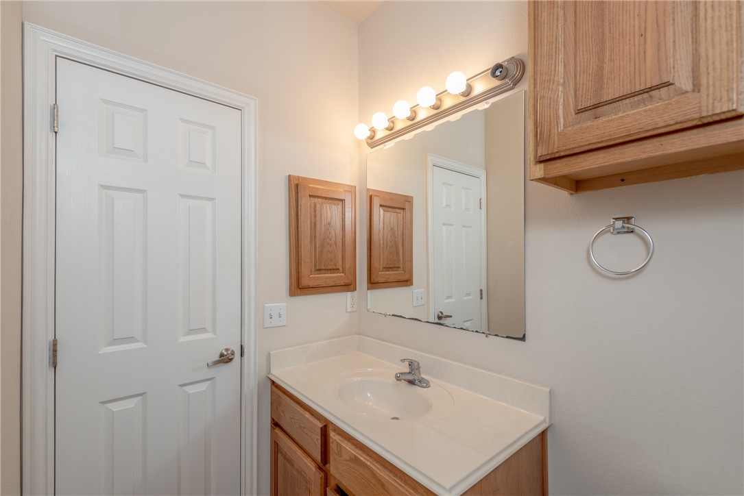 1001 Krenek Tap Road, Unit 1102 College Station, TX 77840 - Photo 22 of 26 a bathroom with a sink and a mirror