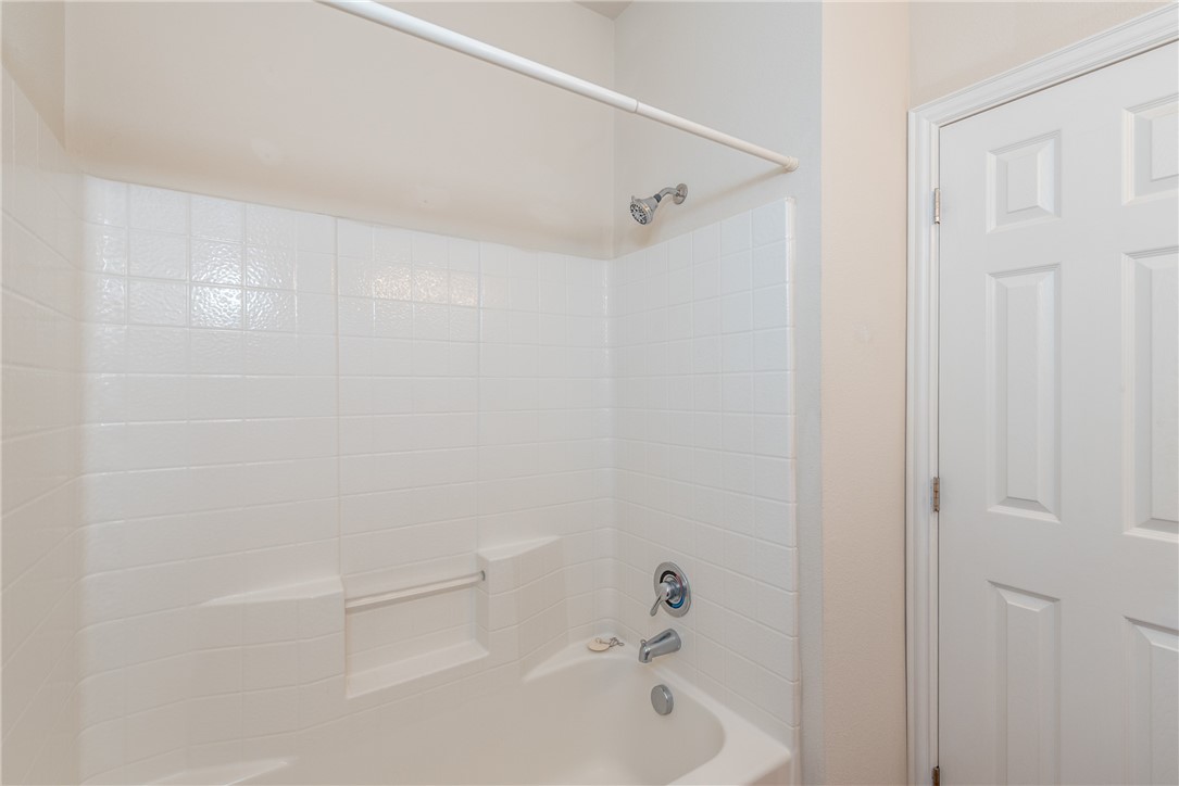 1001 Krenek Tap Road, Unit 1102 College Station, TX 77840 - Photo 23 of 26 a bathroom with a bathtub