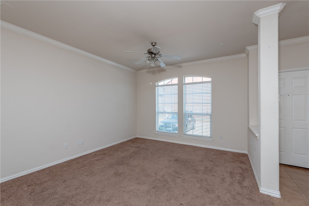 1001 Krenek Tap Road, Unit 1102 College Station, TX 77840 - Photo 3 of 26 an empty room with a window and a fan