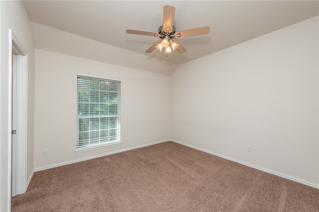 1001 Krenek Tap Road, Unit 1102 College Station, TX 77840 - Photo 9 of 26 an empty room with windows and fan
