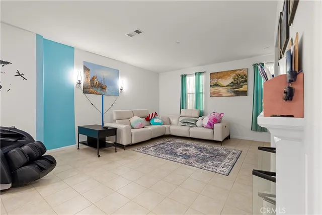 a bedroom with furniture and a lamp