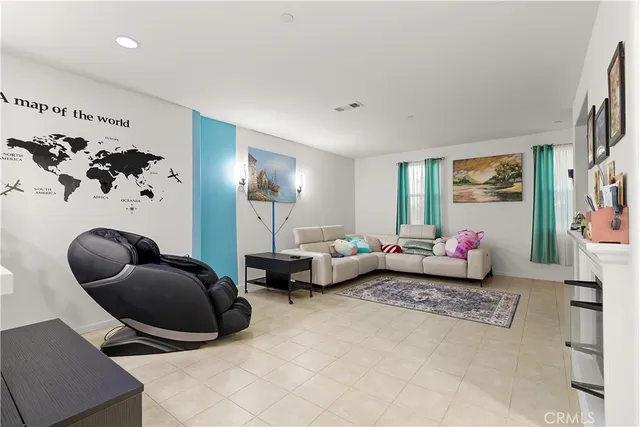 a living room with furniture rug and window
