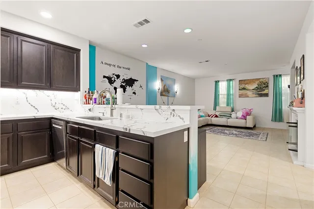 a kitchen with a sink and cabinets