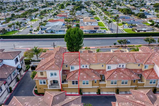 an aerial view of residential houses and outdoor space