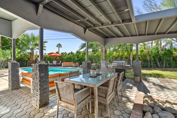 a outdoor space with patio lots of furniture and garden view