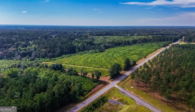 a view of a yard with an outdoor seating