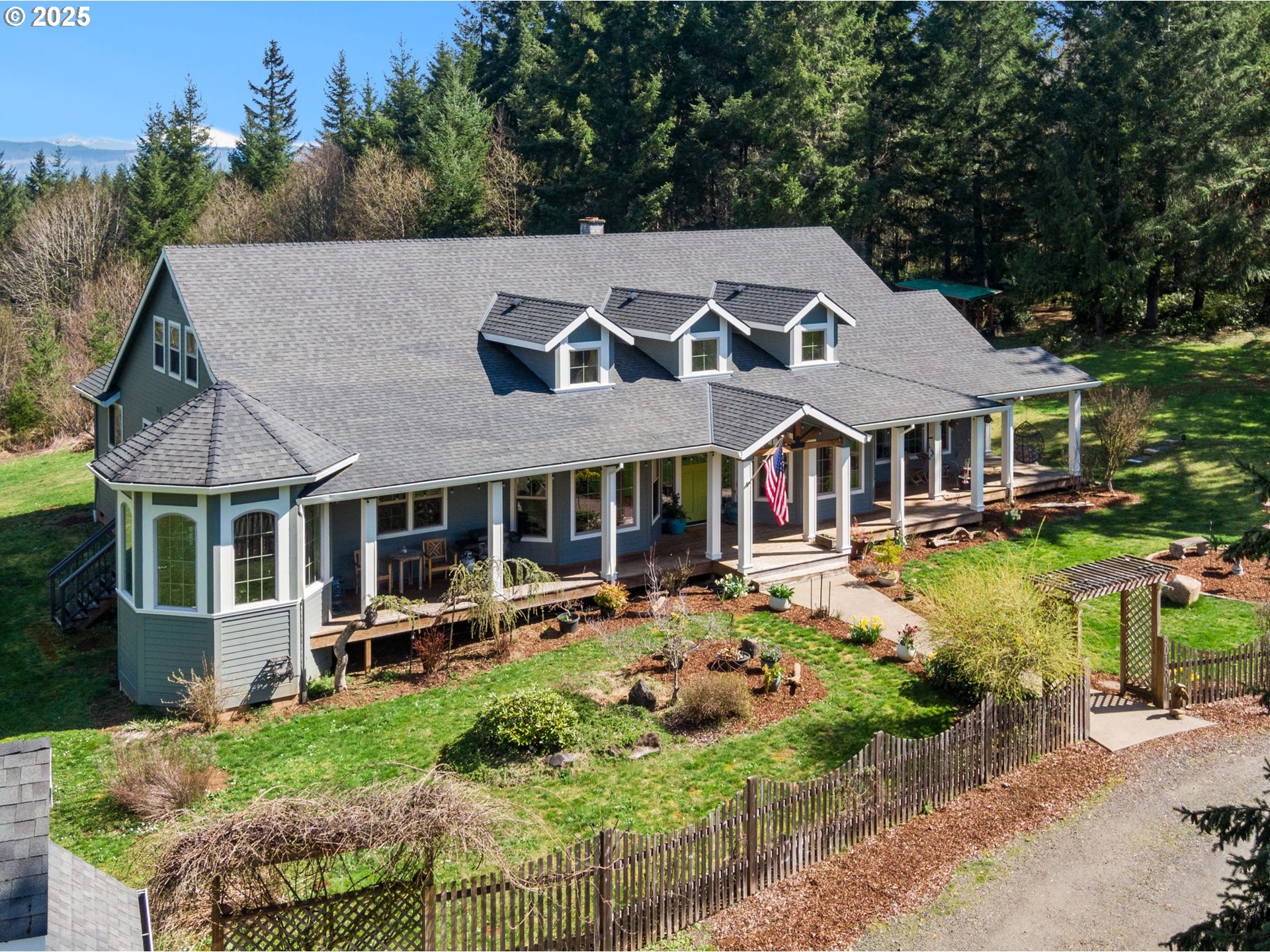 a aerial view of a house with swimming pool and a yard