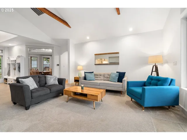 a living room with furniture and a couch