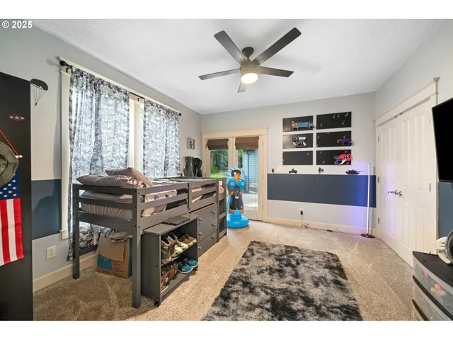 a bedroom with furniture and windows