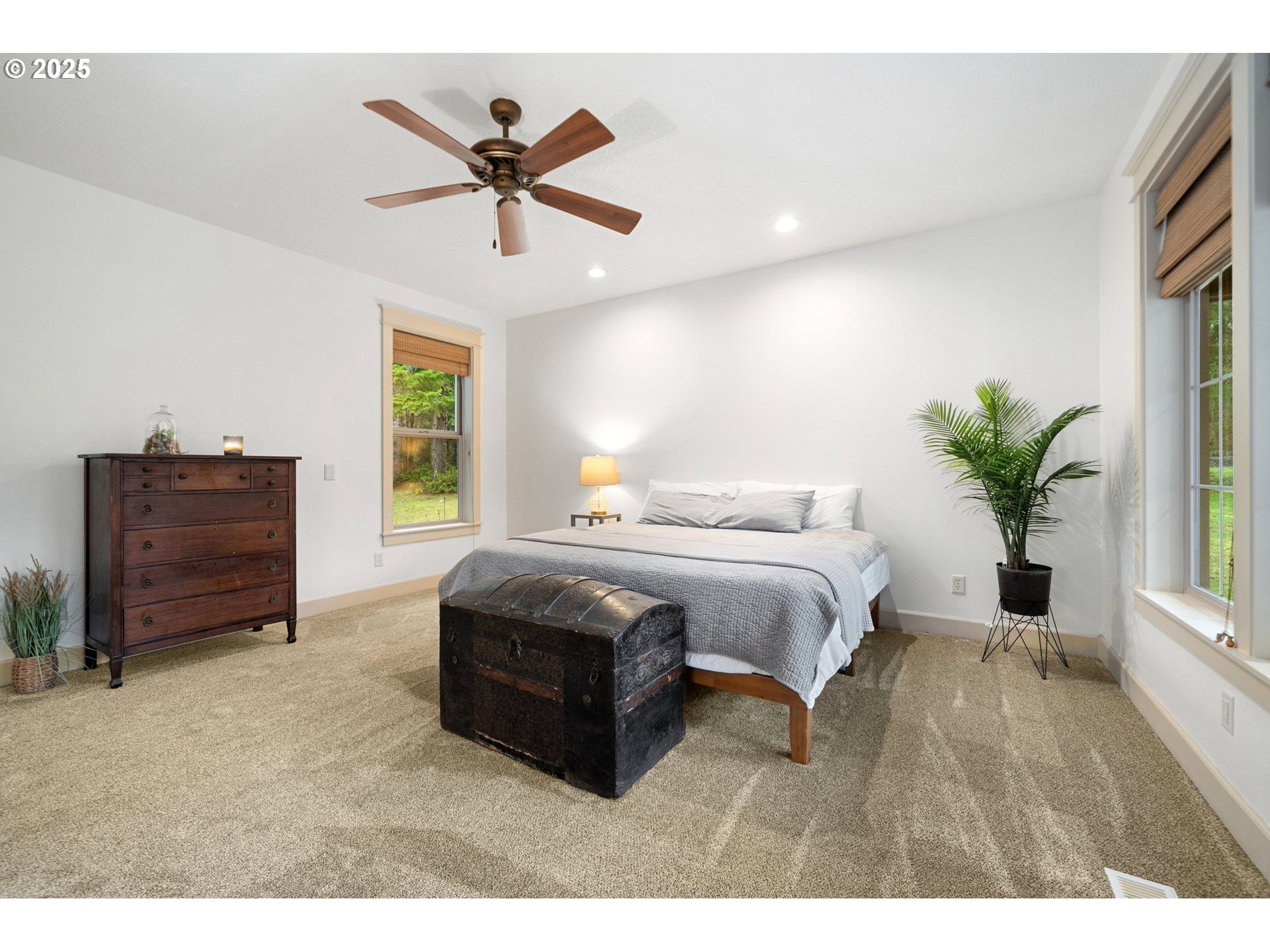 30180 Carrico Valley Road St. Helens, OR 97051 - Photo 25 of 48 a spacious bedroom with a bed and a potted plant