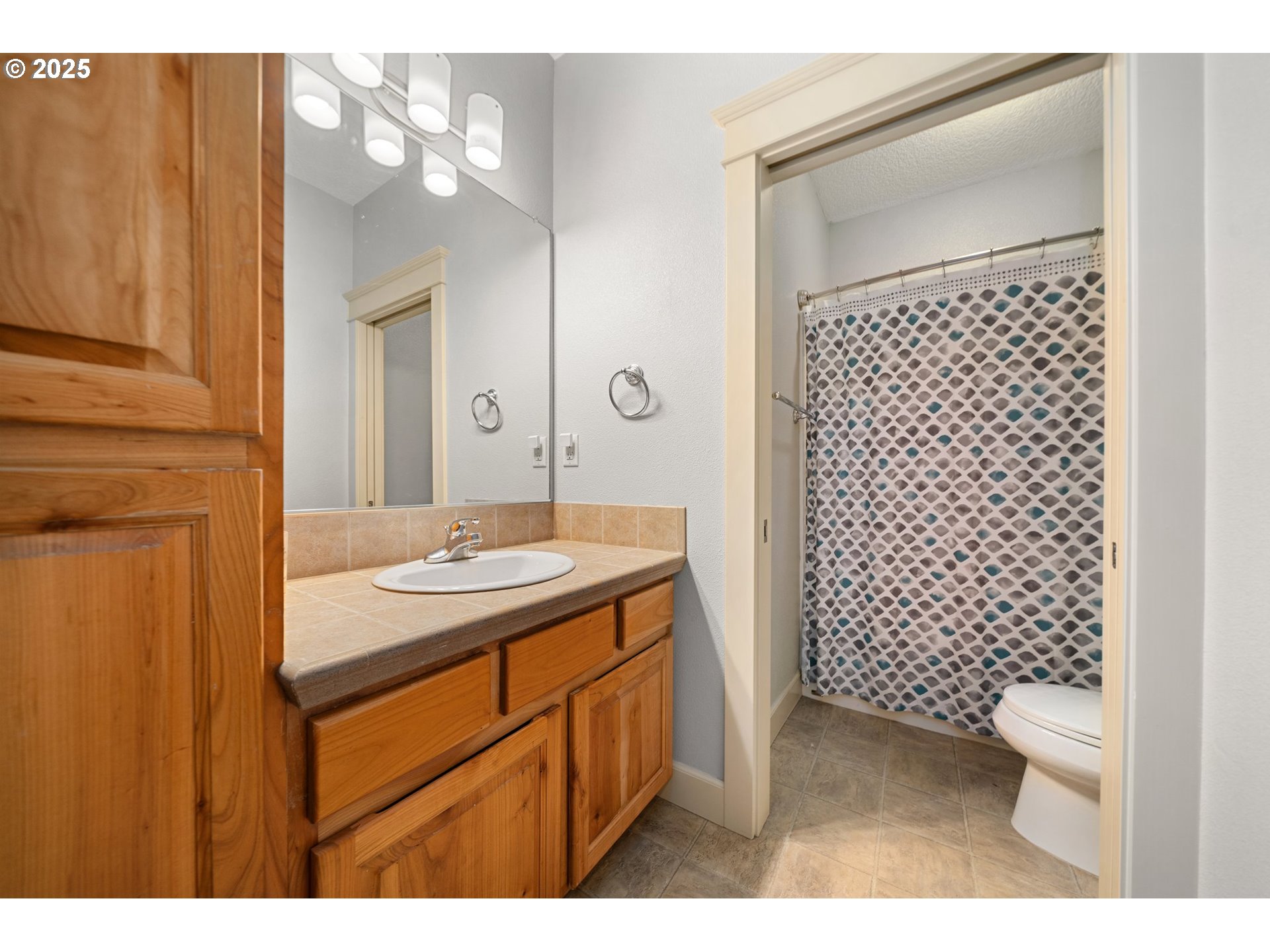 30180 Carrico Valley Road St. Helens, OR 97051 - Photo 27 of 48 a bathroom with a sink a toilet and shower