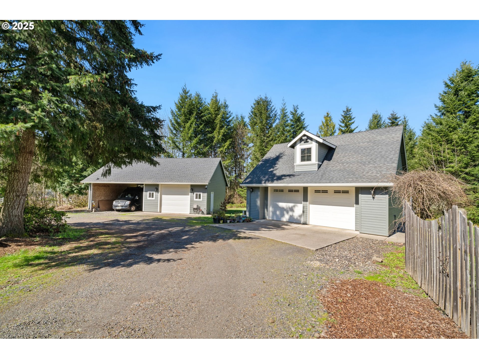 30180 Carrico Valley Road St. Helens, OR 97051 - Photo 36 of 48 a front view of a house with a yard and garage