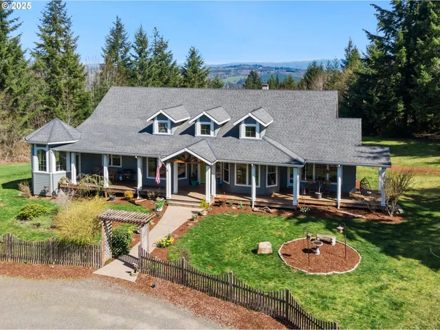 a front view of a house with garden and outdoor seating
