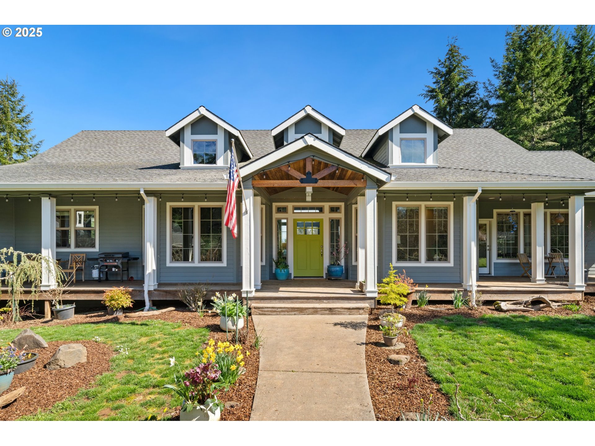 30180 Carrico Valley Road St. Helens, OR 97051 - Photo 5 of 48 a front view of a house with a yard table and chairs