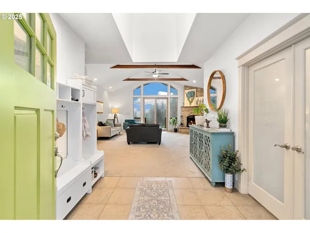 a large white kitchen with a large window