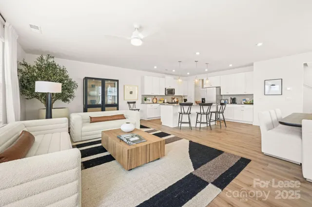 a living room with furniture and a table