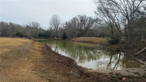 a backyard of a house with yard and lake view