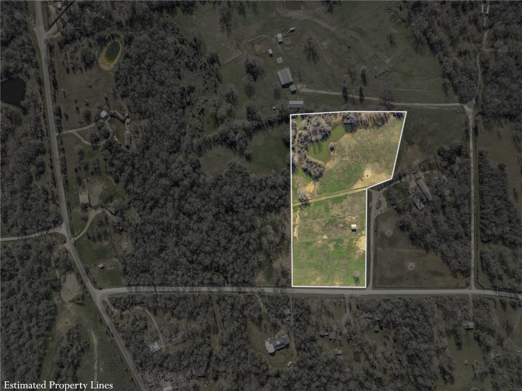 2 River Ridge Drive Hearne, TX 77859 - Photo 17 of 18 a small garden covered with tall trees