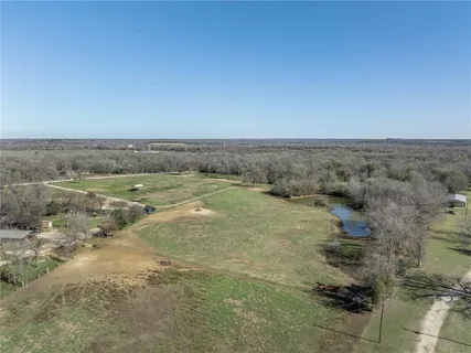 a aerial view of a house with a yard