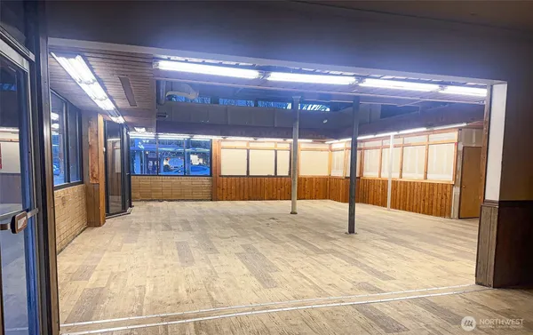 a view of an empty room with a fireplace