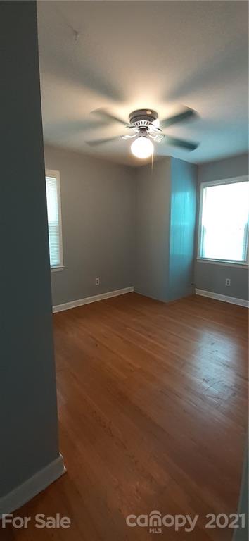 5111 Lodestone Road Charlotte, NC 28215 - Photo 17 of 19 an empty room with a empty space and windows