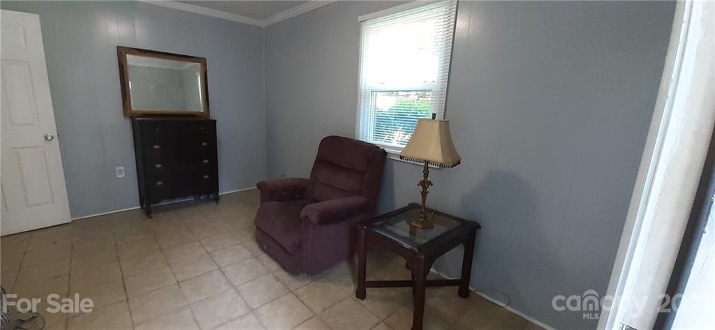 5111 Lodestone Road Charlotte, NC 28215 - Photo 18 of 19 a living room with furniture and a window