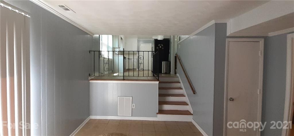 5111 Lodestone Road Charlotte, NC 28215 - Photo 4 of 19 a view of entryway and hall with wooden floor