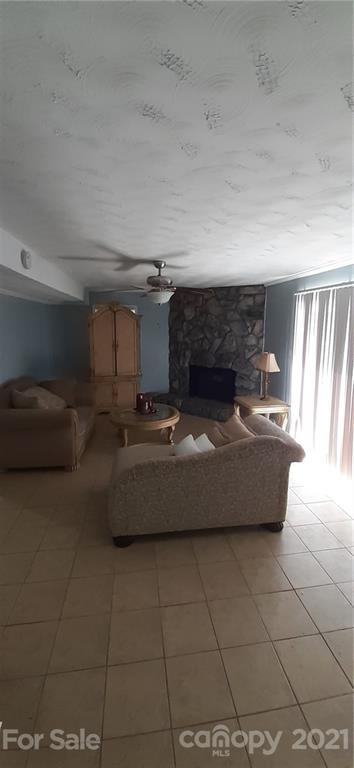 5111 Lodestone Road Charlotte, NC 28215 - Photo 5 of 19 a room with a couch