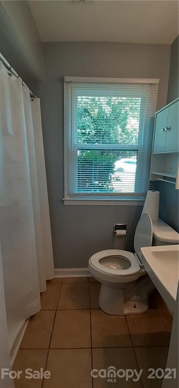 5111 Lodestone Road Charlotte, NC 28215 - Photo 6 of 19 a bathroom with a sink toilet and window