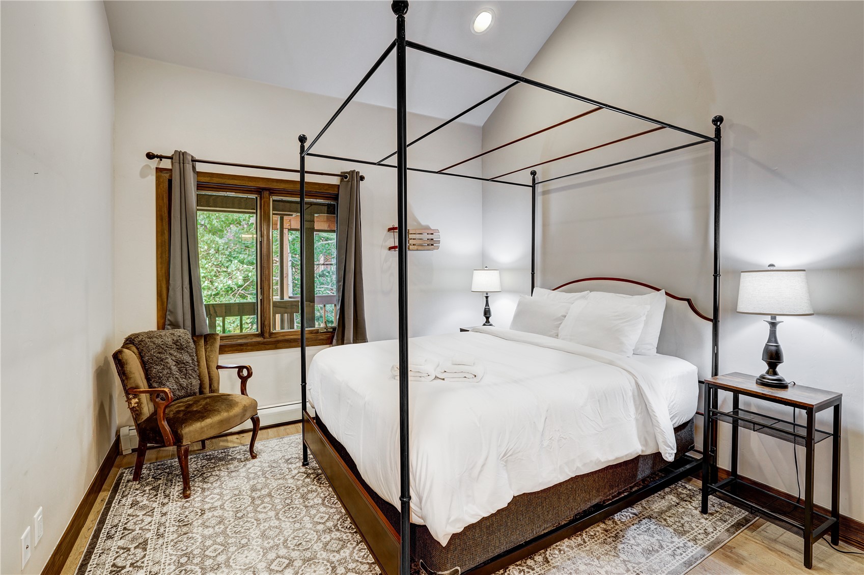 620 4 O Clock Road, Unit 336 Breckenridge, CO 80424 - Photo 9 of 29 Bedroom featuring vaulted ceiling and hardwood / wood-style floors