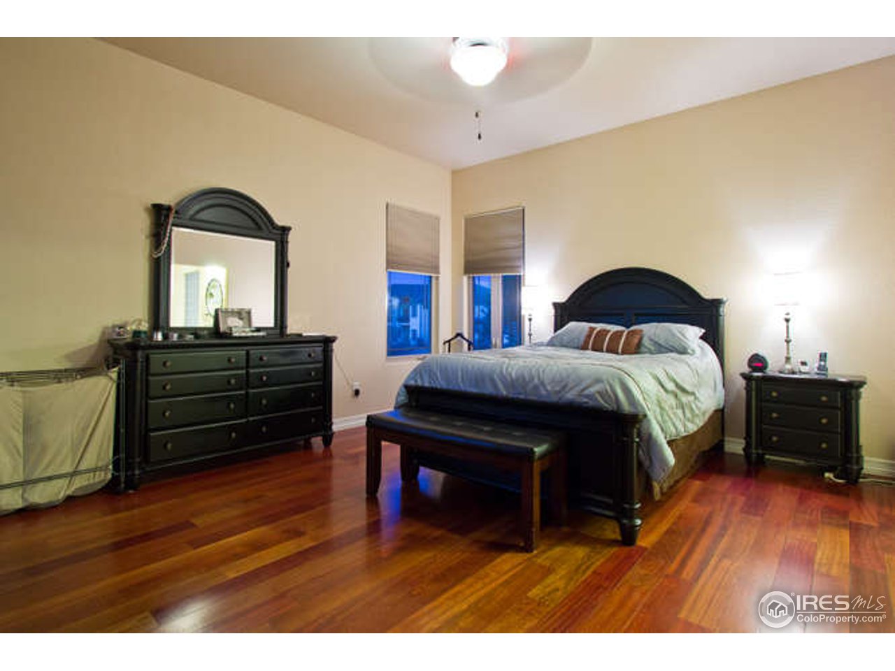7737 Poudre River Road Greeley, CO 80634 - Photo 11 of 20 Large master bedroom with Brazilian Cherry floors