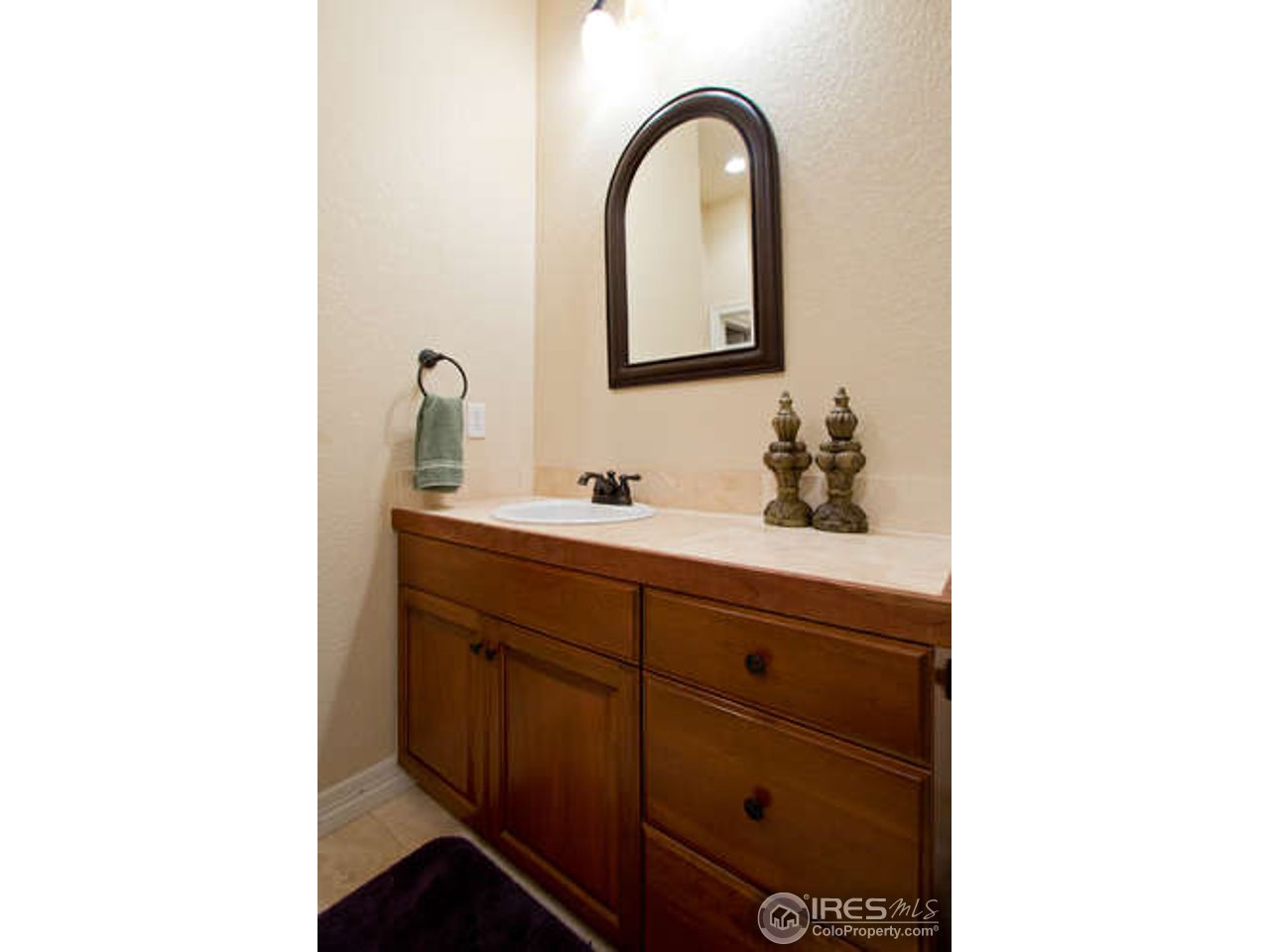 7737 Poudre River Road Greeley, CO 80634 - Photo 15 of 20 Hard surface tops in all bathrooms