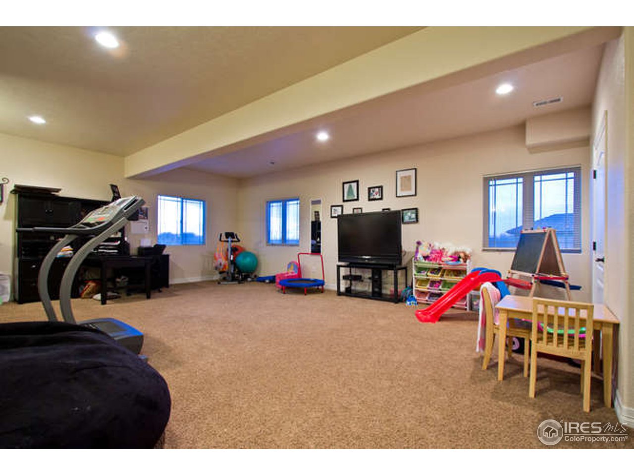 7737 Poudre River Road Greeley, CO 80634 - Photo 18 of 20 Oversized game room that could be used as bedroom