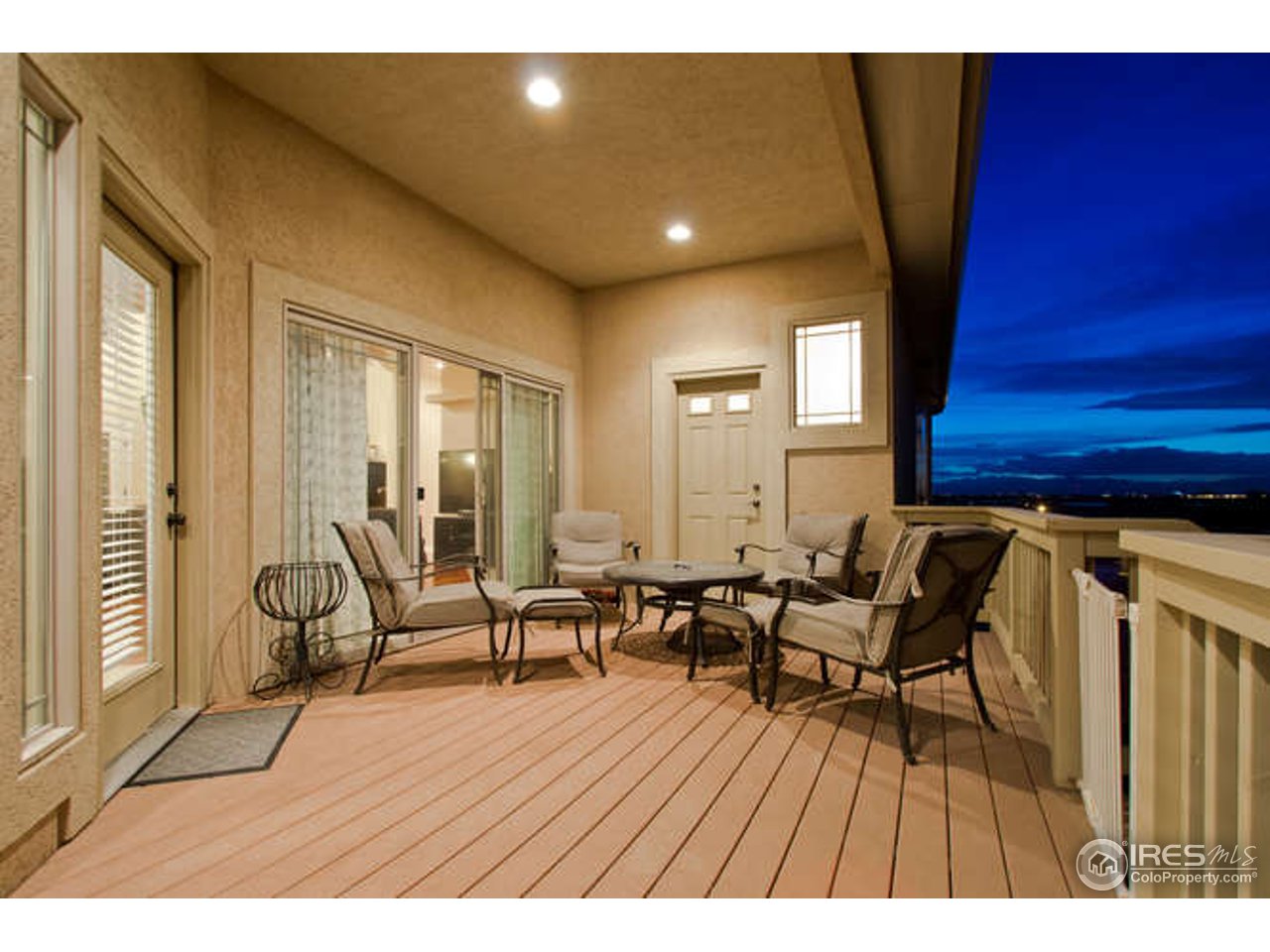7737 Poudre River Road Greeley, CO 80634 - Photo 4 of 20 Deck with access off master, family, and guest rms