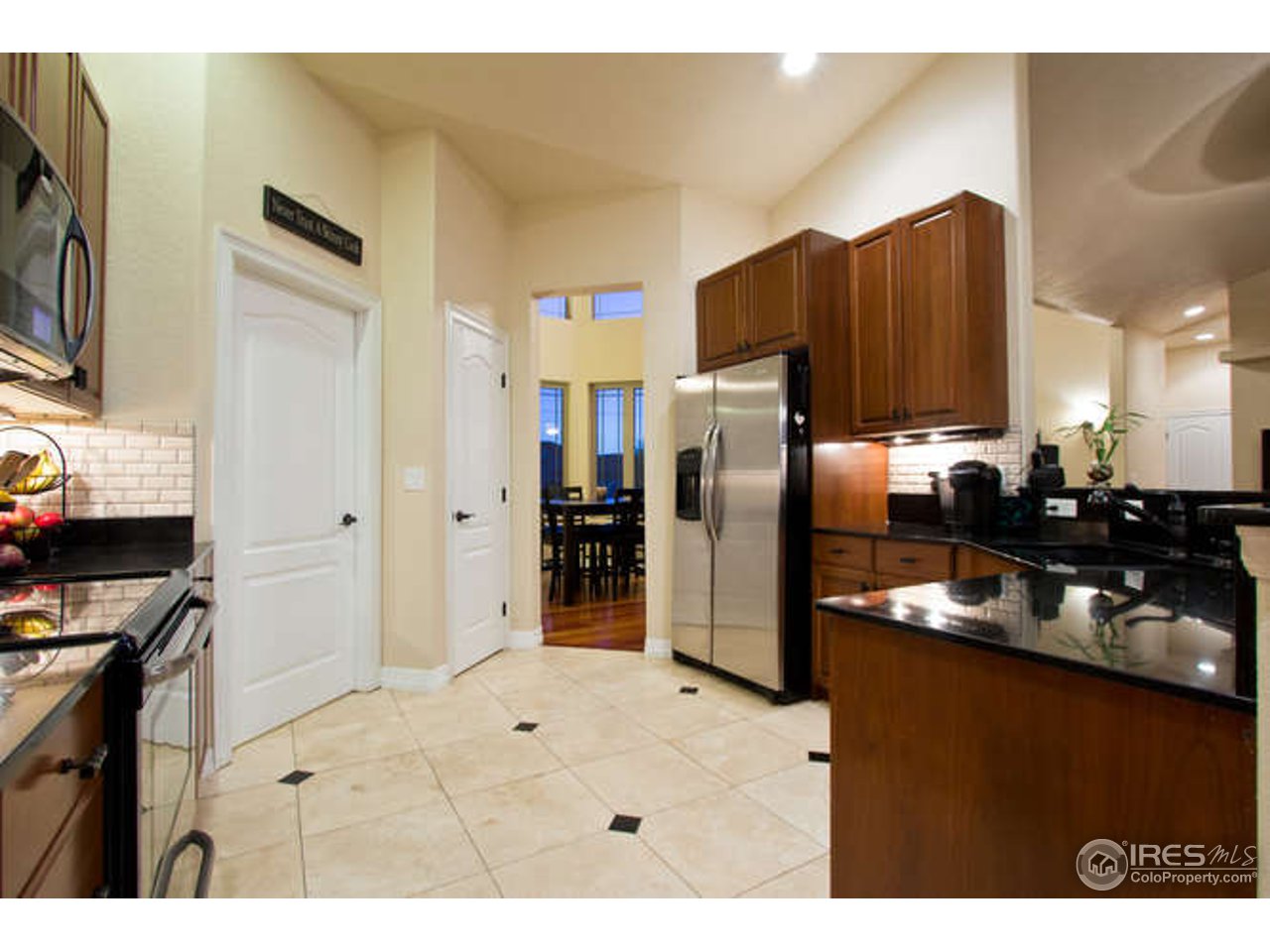 7737 Poudre River Road Greeley, CO 80634 - Photo 9 of 20 Travertine tile in all wet areas