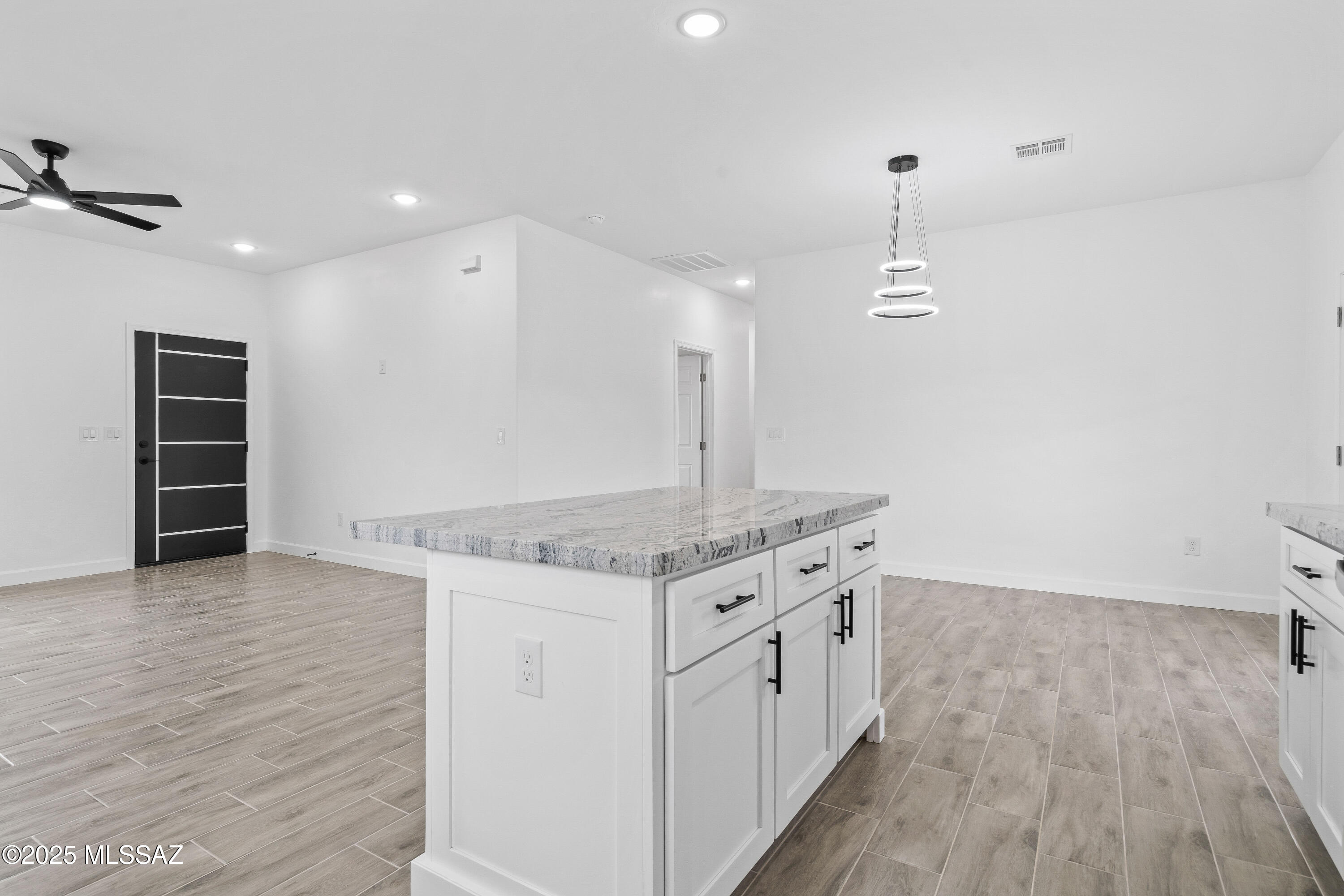 1851 Calle Salmon Rio Rico, AZ 85648 - Photo 17 of 29 a kitchen with a stove and wooden floor