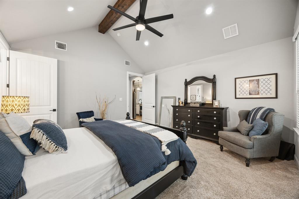 1800 Knox Road Tolar, TX 76476 - Photo 15 of 38 Spacious bedroom featuring a vaulted ceiling with exposed wood beam, recessed lighting, ceiling fan, and light-colored carpet flooring