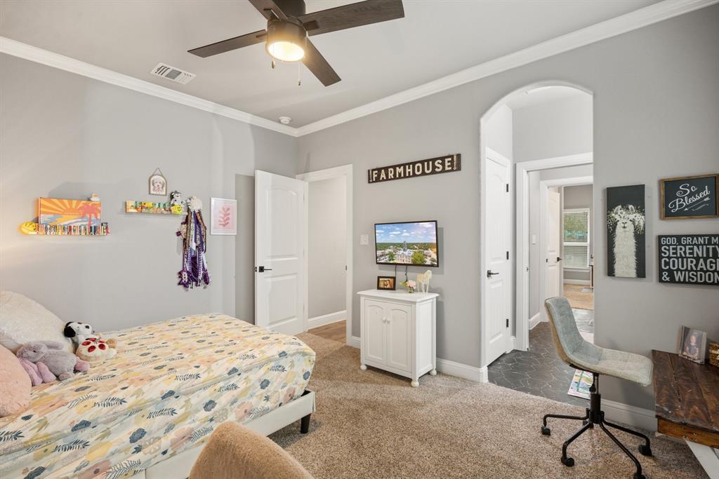 1800 Knox Road Tolar, TX 76476 - Photo 21 of 38 Bedroom #3 has an arched doorway leading to a tiled Jack & Jill bathroom that shares with Bedroom #4/Office