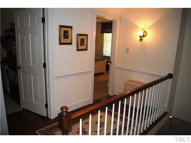 1505 Farmington Court Raleigh, NC 27615 - Photo 18 of 25 Second floor landing opens to all four bedrooms and one full bath. Hardwoods in this home are in new condition. Open and airy this second floor landing is very inviting. Interior Space/Layout