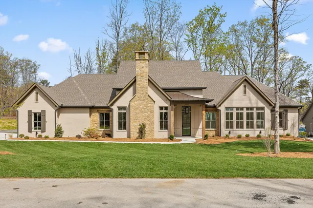 front view of a house with a yard