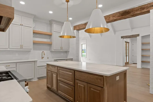 a kitchen with a sink cabinets and window