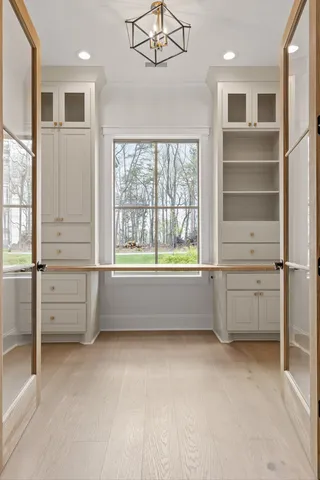 a view of room with cabinet and windows