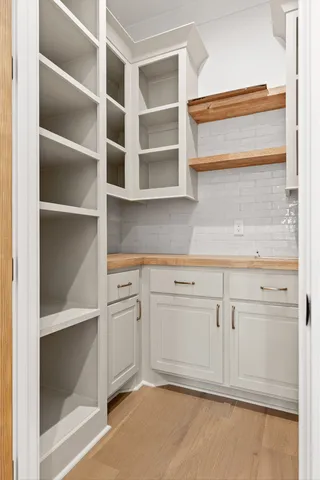 a kitchen with cabinets and window