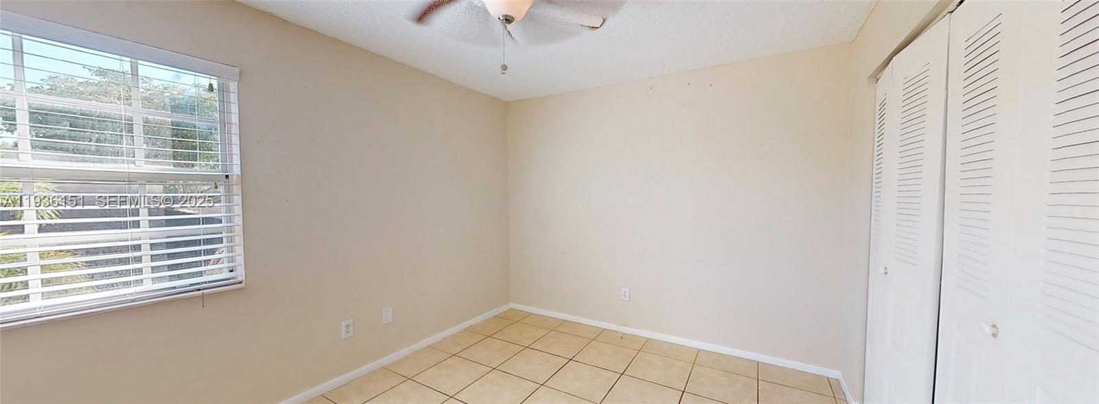 4235 Southwest 148th Place Miami, FL 33185 - Photo 12 of 23 a view of an empty room with a window