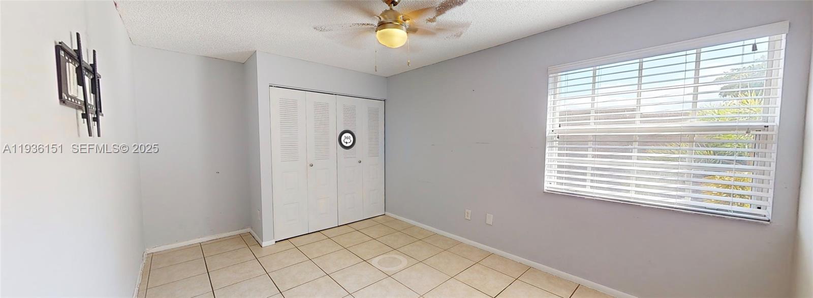 4235 Southwest 148th Place Miami, FL 33185 - Photo 13 of 23 a view of an empty room with a window